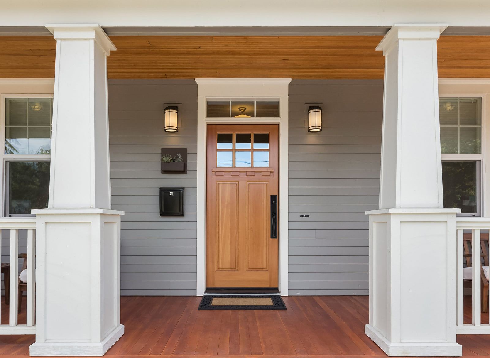 modern craftsman front door with wooden door and ageless iron black door hardware handleset